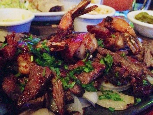 Traditional bacon-wrapped shrimp and fajitas. Whose tradition exactly is a mystery.