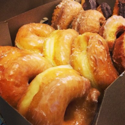 A dozen doughy little angels, living in a box.